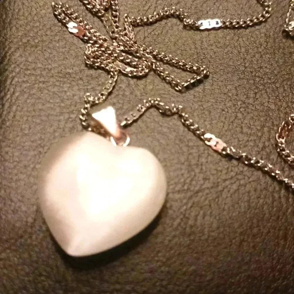 NWT pearl white heart charm with stainless steel necklace..